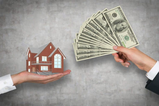 Asian businesswoman discusses home purchase contracts with clients at her desk, focusing on loans, mortgages, and other financial aspects of real estate transactions.